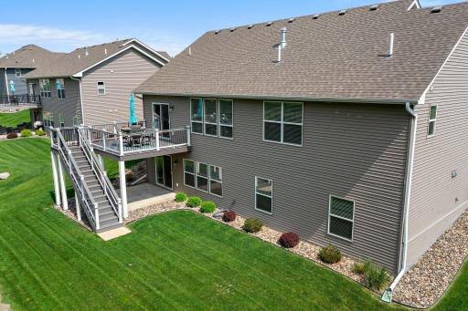 This home includes a concrete patio underneath the deck.