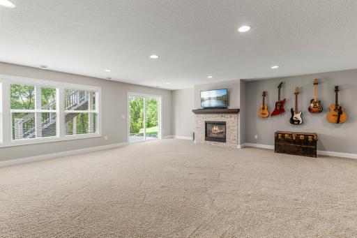 The lower level includes a huge family room, complete with a stone fireplace.