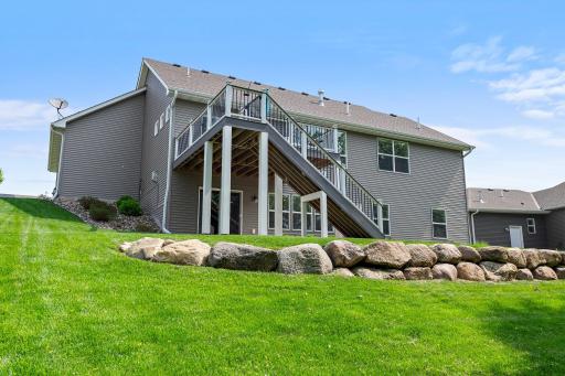 The backyard includes striking landscaping.