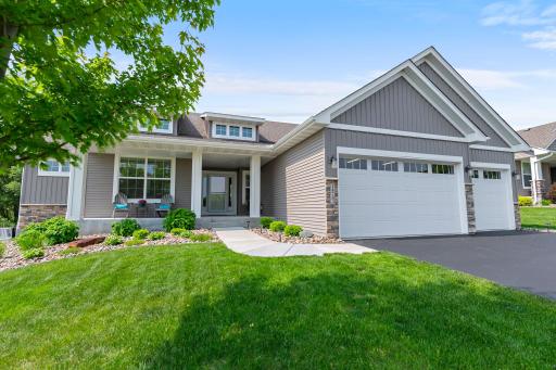 This home features a covered front porch and beautiful touches such as the brick accents on the front of the home.