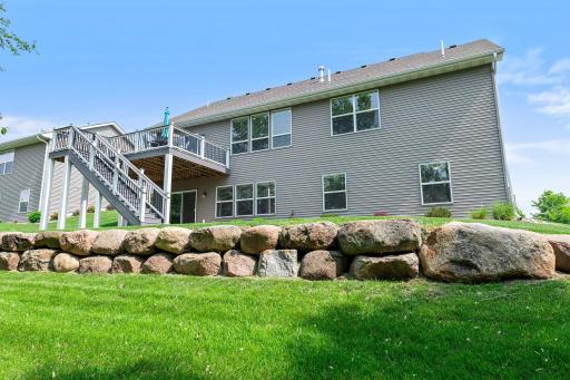 The backyard includes striking landscaping.