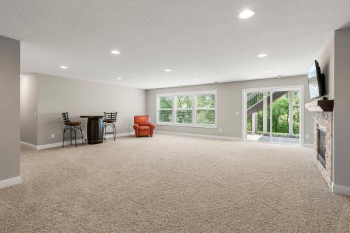 The lower level includes a huge family room, complete with a stone fireplace.
