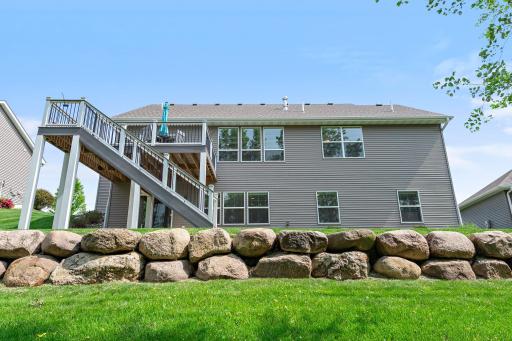 The backyard includes striking landscaping.