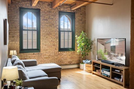 Step into one of the North Loop’s most iconic historic loft buildings, Riverwalk Lofts.