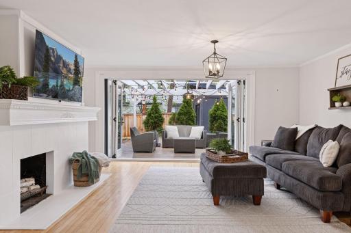 The living room connects effortlessly to the outdoor deck, perfect for summer entertaining.