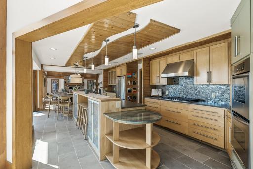 An entertainerâs dream kitchenâexpansive, elegant, and fully equipped with everything you need to host with ease. From the oversized island to the double ovens and bar area, every detail invites connection, conversation, and unforgettable gatherings.