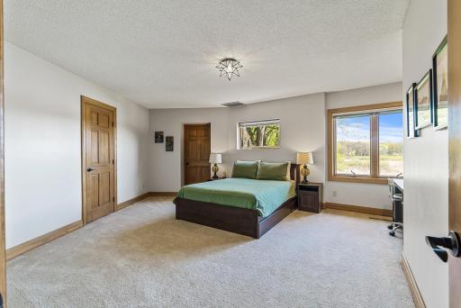 With ample space and sun-filled windows, this bedroom offers a perfect blend of comfort and serenity.