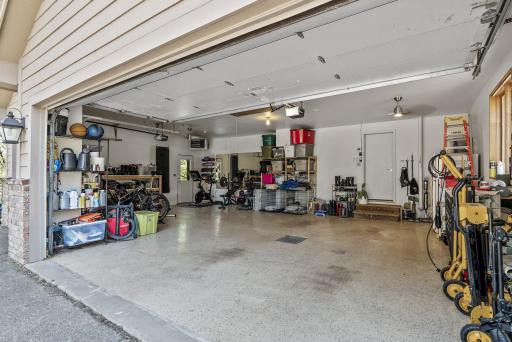 Stay warm year-round with this spacious, heated 3-car garageâplus attic storage above.