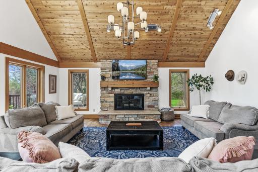A true centerpieceâgather around this grand stone fireplace on chilly nights, a statement of comfort and luxury.