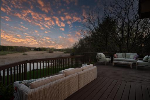 Host golden hour gatherings on the expansive deck, complete with built-in solar lighting and peaceful pond views.
