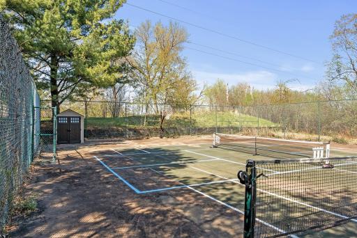 Game on! Whether you're into tennis or pickleball, this private court is a rare find.