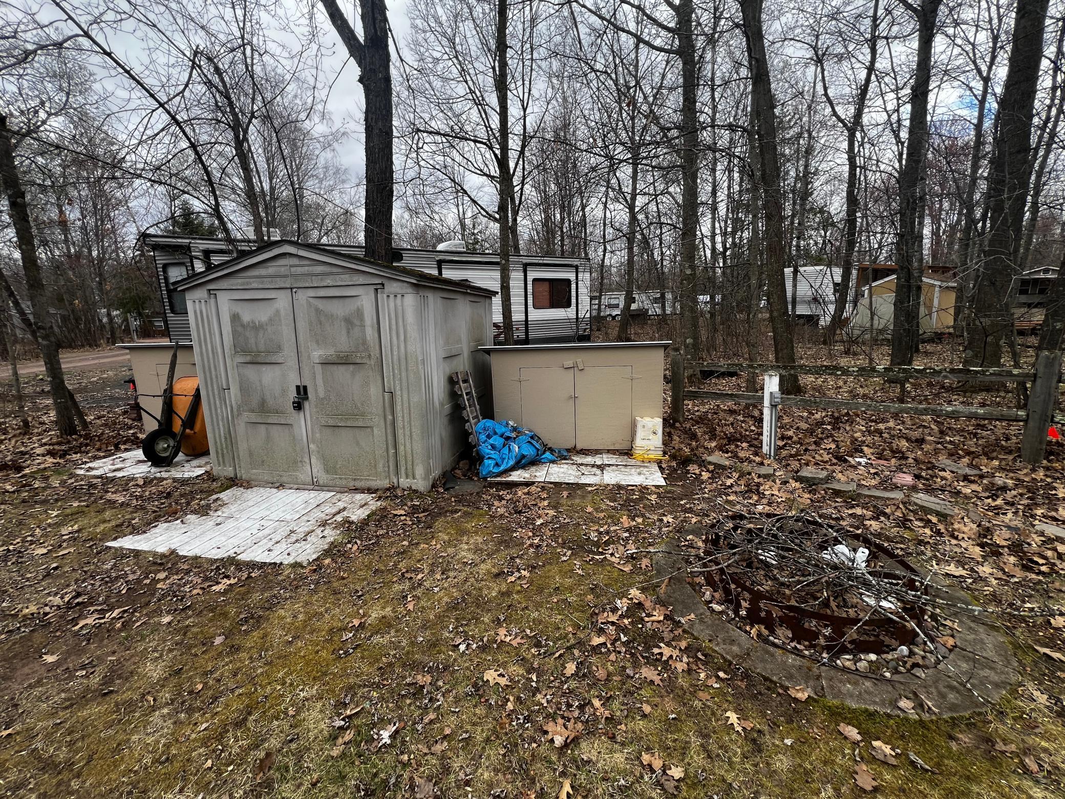 Sheds and firepit for next owner!