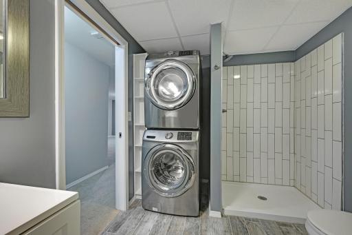 Lower Level Bathroom with Laundry, Front load Samsung Washer & Dryer