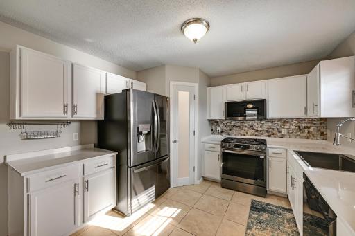 Kitchen with new quartz counter tops and Pantry
