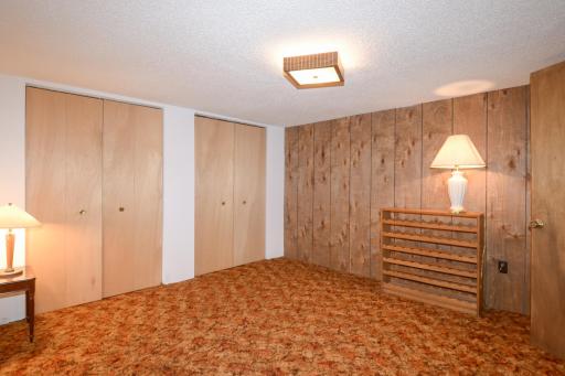 Lower level den -add an egress window for a 4th bedroom.