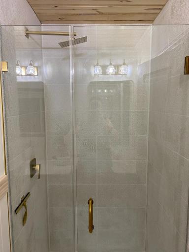 Rainshower, tile surround, brushed gold hardware