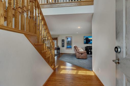 Photo for 5801 16th Street N, Saint Cloud, MN 56303 - Listing #6710576 Front entry with tall vaulted ceilings opening to the main level living room/kitchen