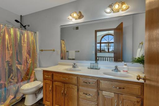 Photo for 5801 16th Street N, Saint Cloud, MN 56303 - Listing #6710576 Guest bathroom with double vanity on upper level