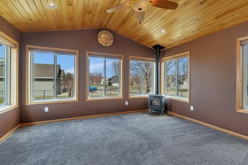 Photo for 5801 16th Street N, Saint Cloud, MN 56303 - Listing #6710576 Four season porch with fireplace and walks out to the patio area outside
