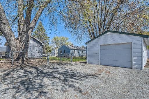 A spacious one & half car garage with ample parking.