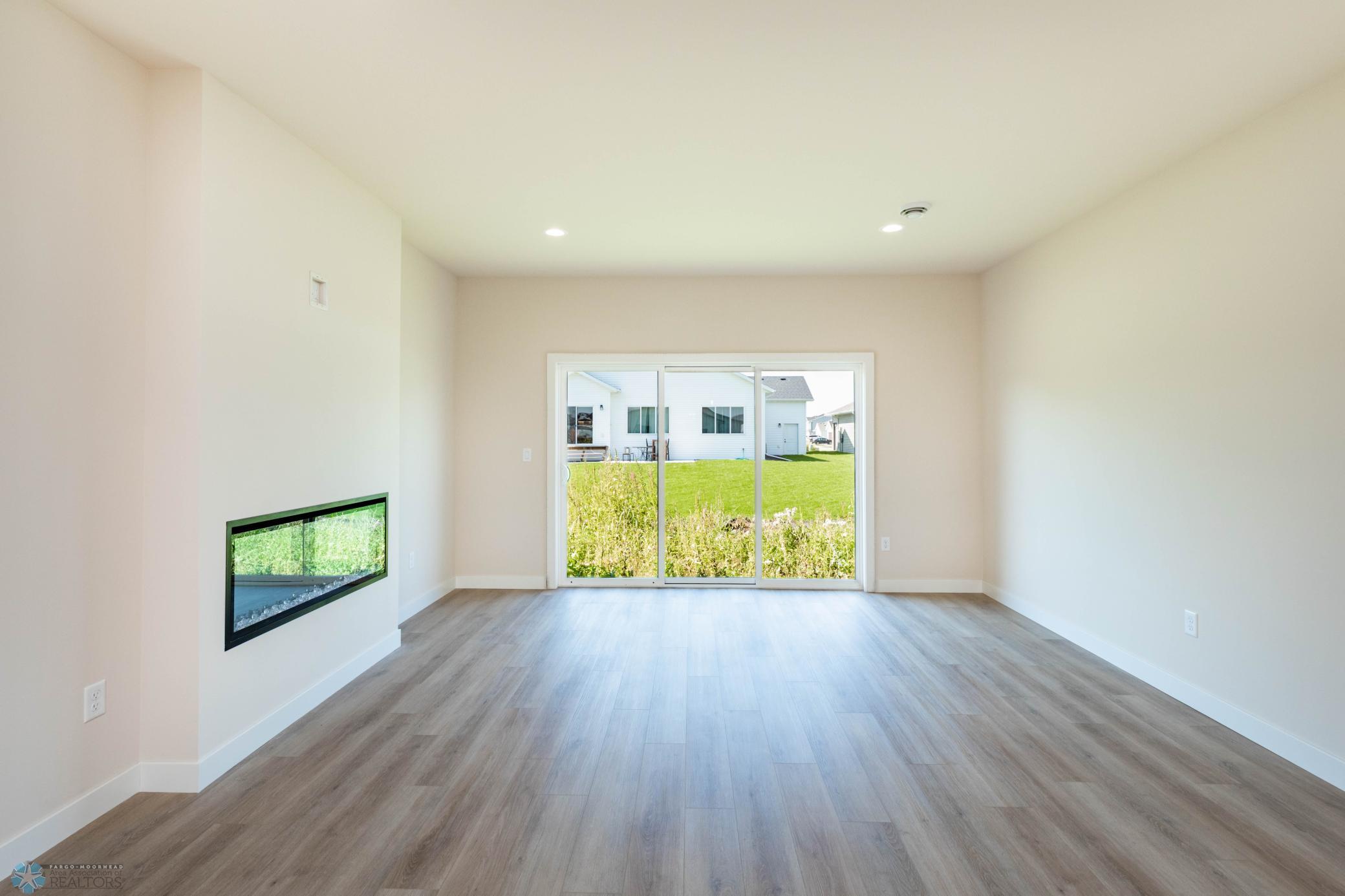 living room w/ 3 panel patio door