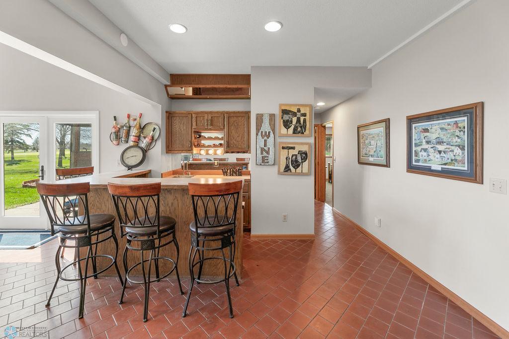 Cool & vintage feel to this wet bar with counter seating