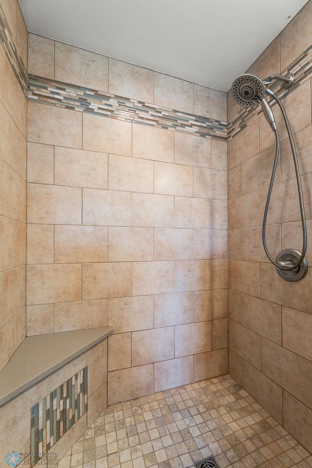 Walk-in shower with seating & handheld shower