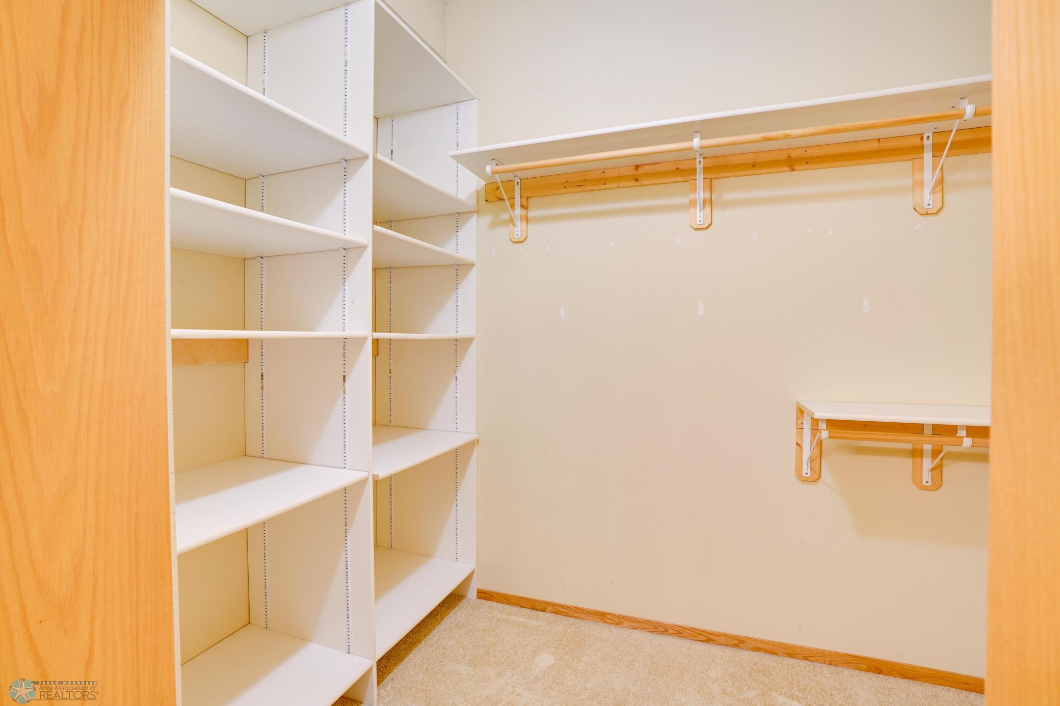 Large walk-in closet with built-in storage & hanging space