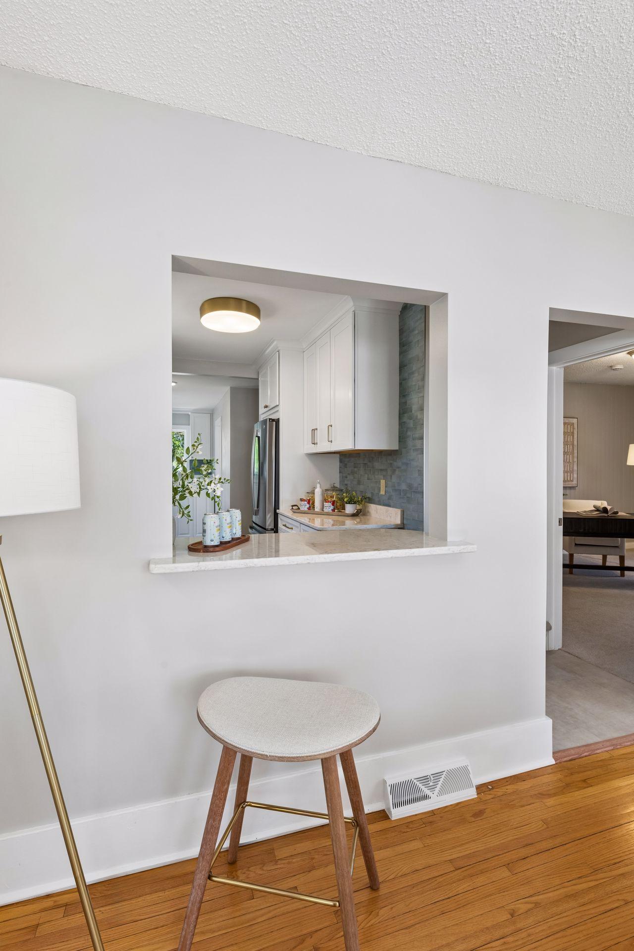 The newly opened window between the kitchen and dining room creates a seamless flow, perfect for entertaining. Or make a quick meal and sit and enjoy.