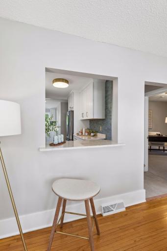 The newly opened window between the kitchen and dining room creates a seamless flow, perfect for entertaining. Or make a quick meal and sit and enjoy.