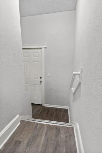 The back entryway leads out to the garage and yard.