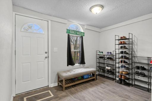 Kick off your shoes in the 11x8 front entry room with LVP flooring.