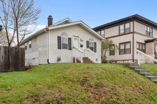 The exterior has low-maintenance vinyl siding, gutters, and downspouts.