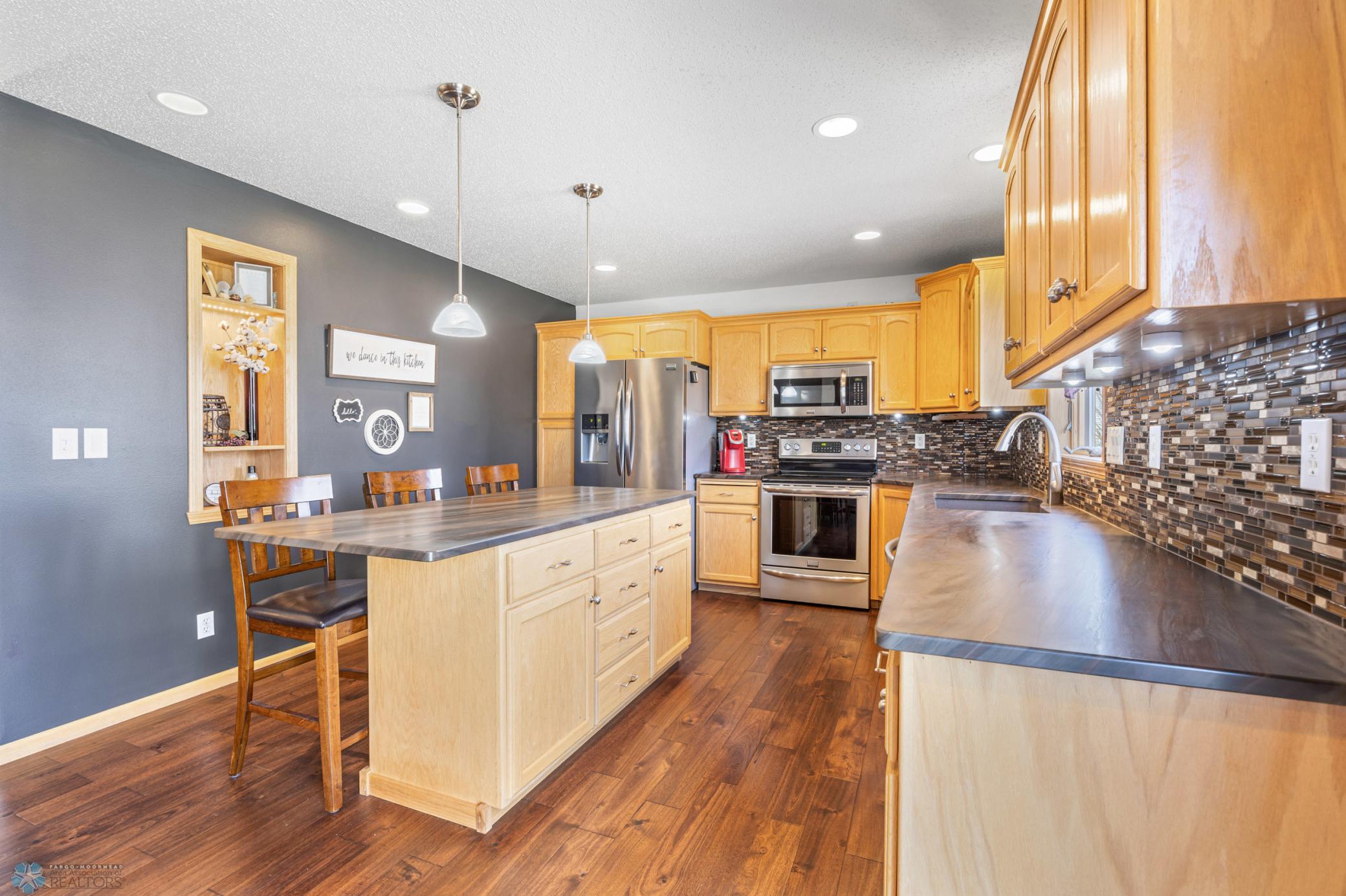 Stainless Steel Appliances & Tile Backsplash