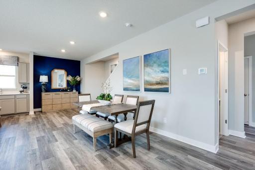 The home's dining area is large enough to fit just about any table and seating arrangement - and resides perfectly within a main level that just makes sense throughout!!