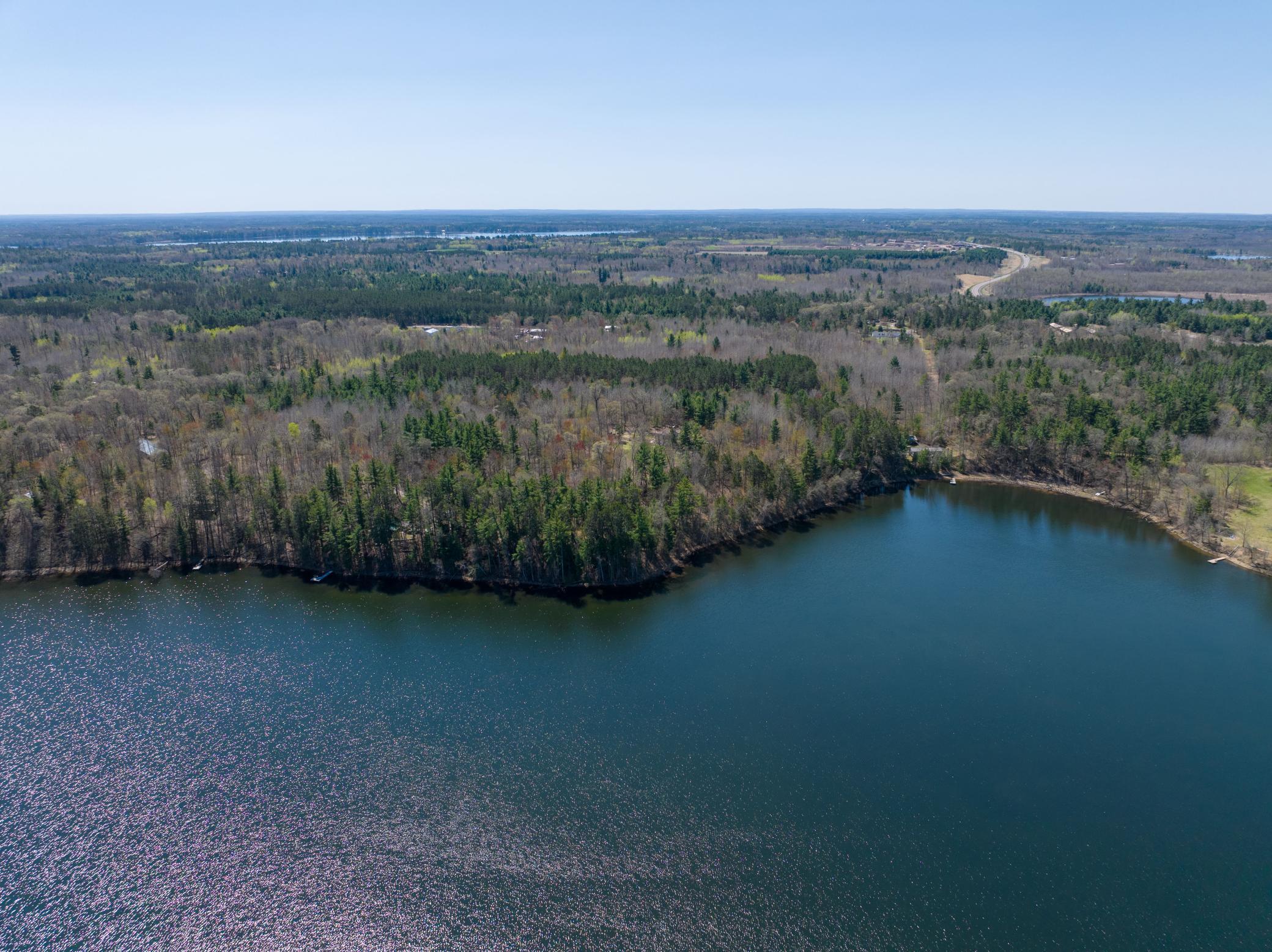 The combination of acreage, lakeshore frontage, and accommodating structures is truly unique.
