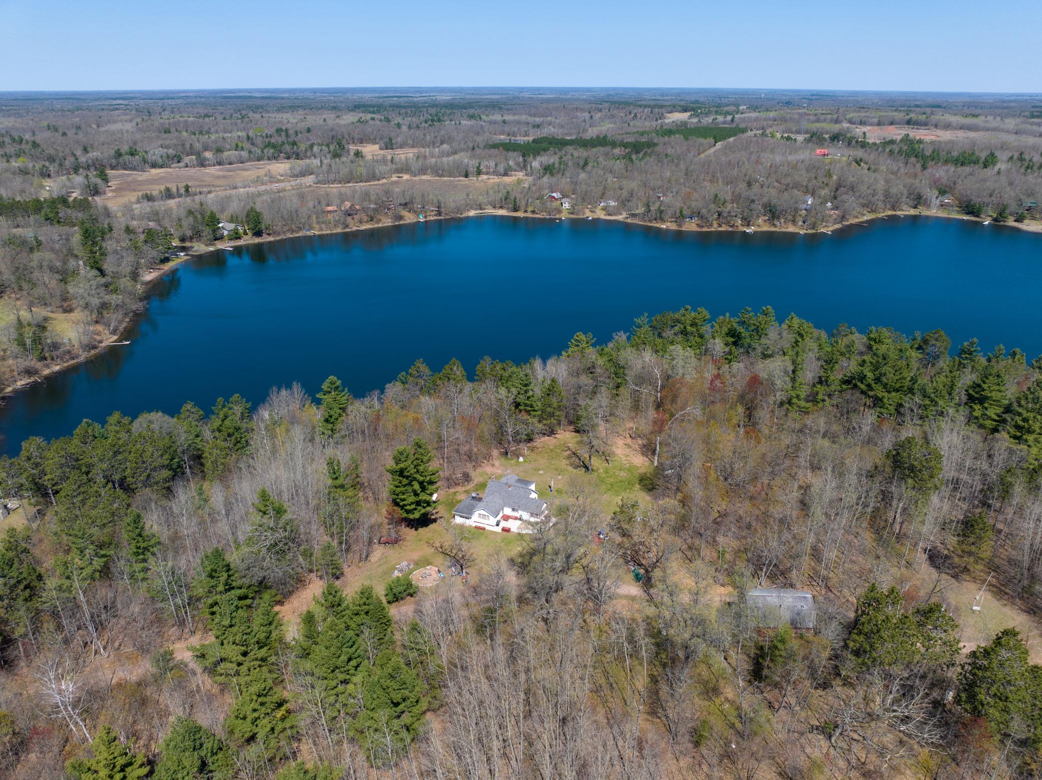 The perfect blend of woodland and lake beauty with privacy and year-round recreation