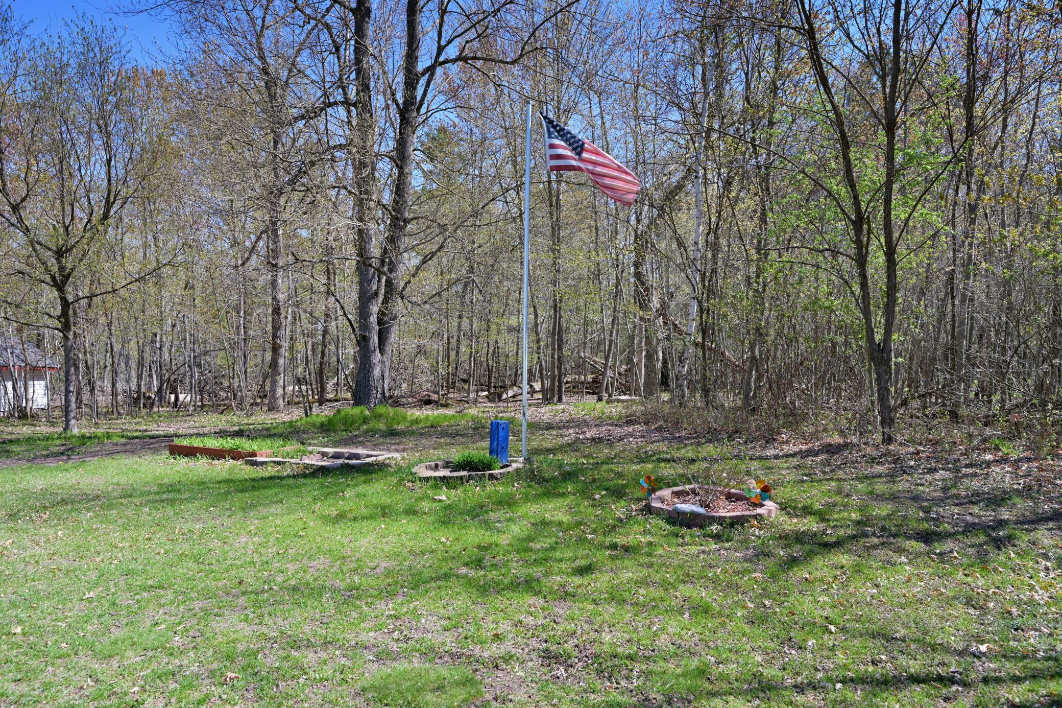 Perfect blend of woodland and lake beauty with privacy and year-round recreation