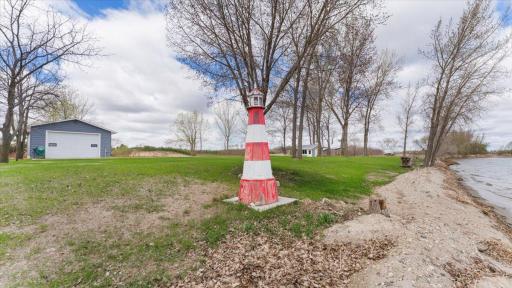 Lighthouse by lake with power & water pump for exterior water spigots