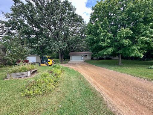 Country setting + Nice attached and detached garage!