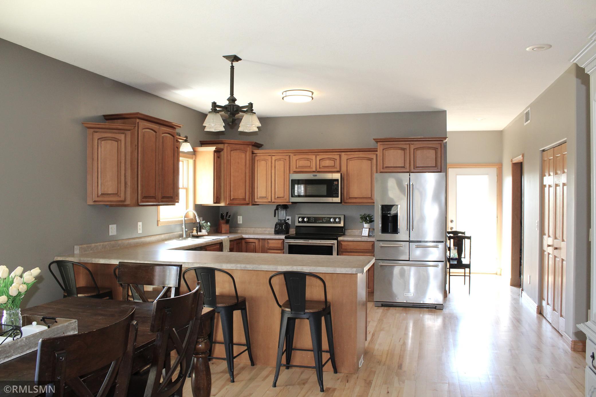 The kitchen peninsula offers the convenience of additional seating