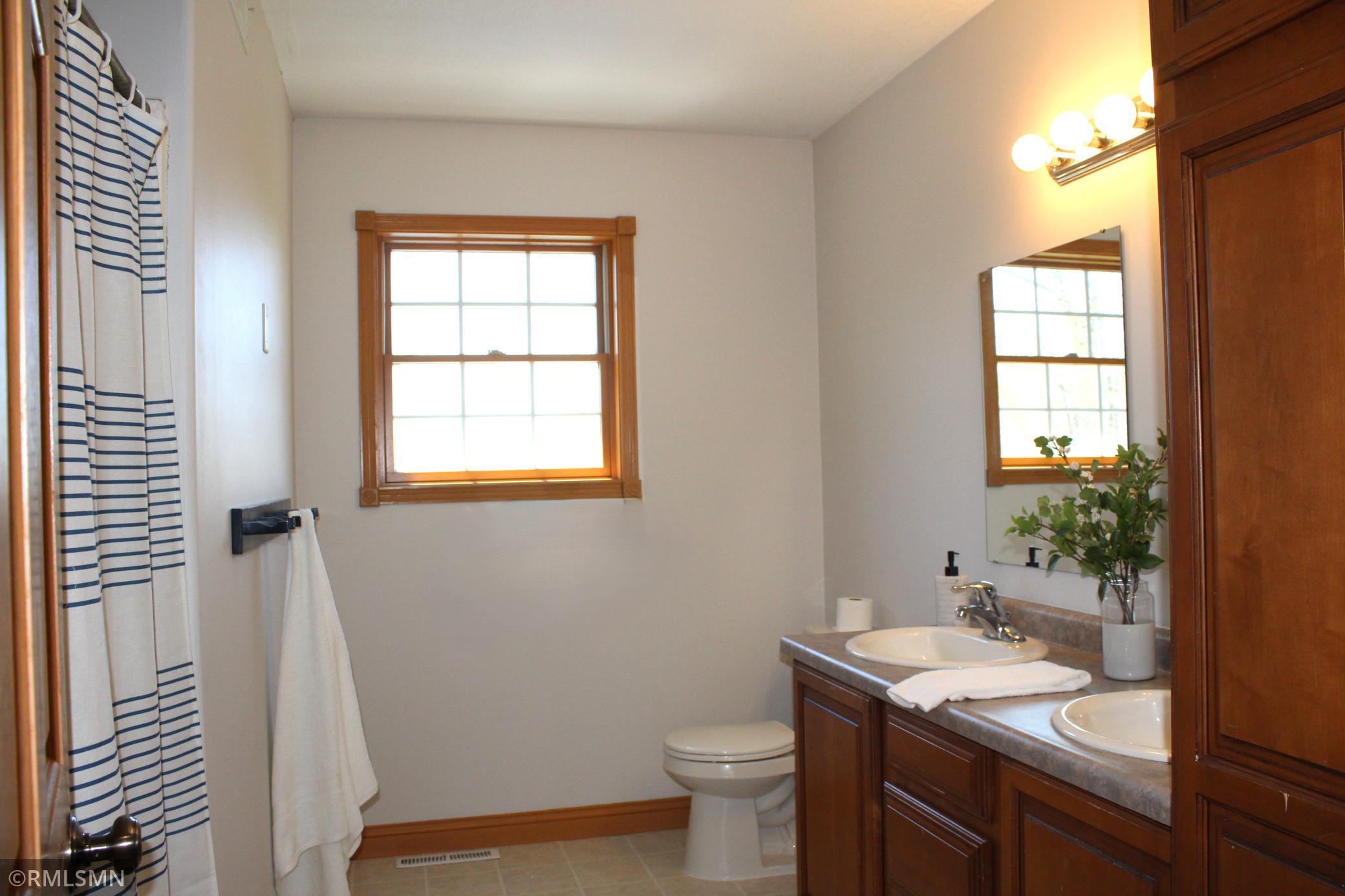 Main bathroom on the second level is a full bath with double vanity sinks