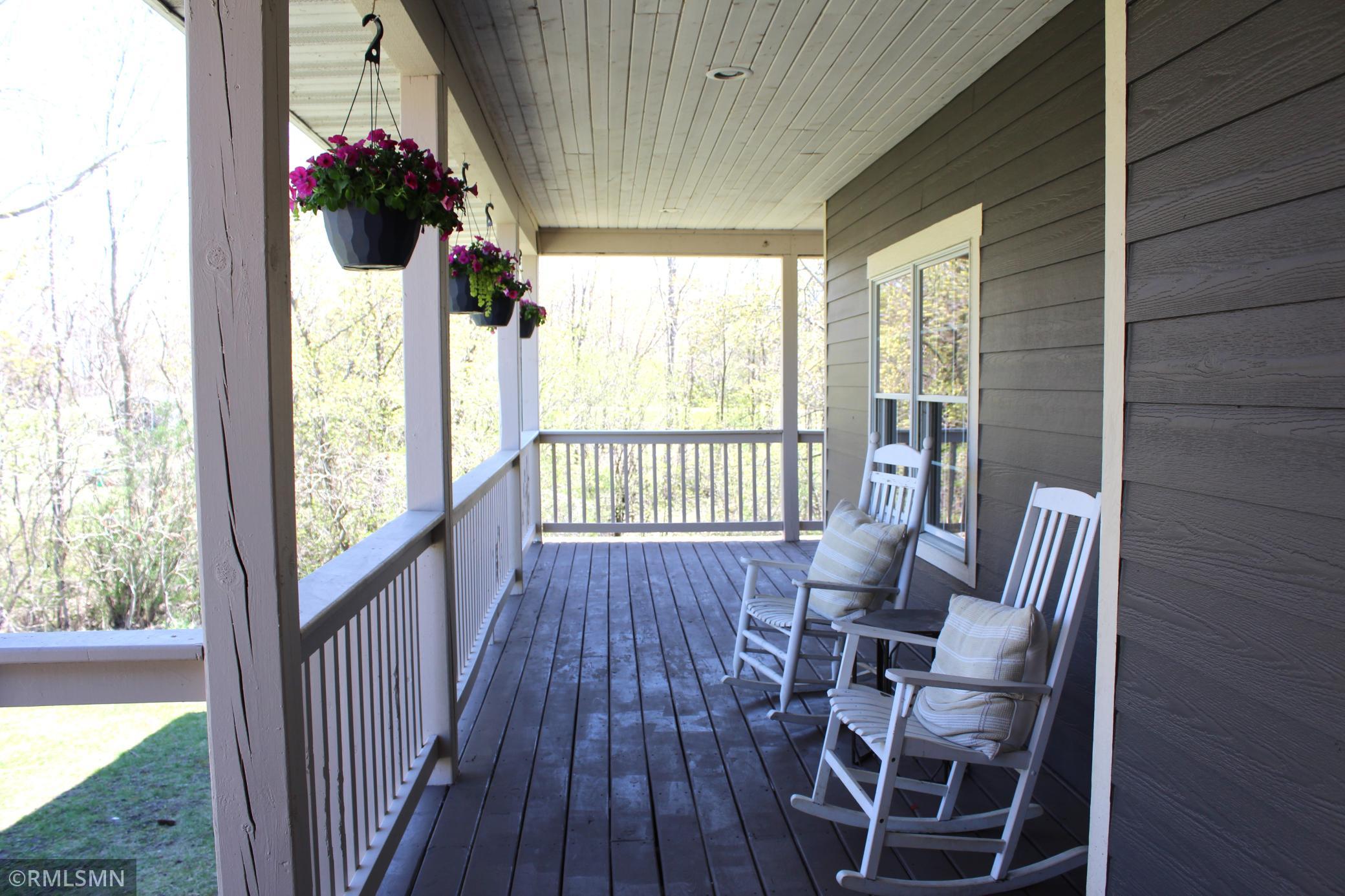 The covered porch wraps around 3 sides of the home