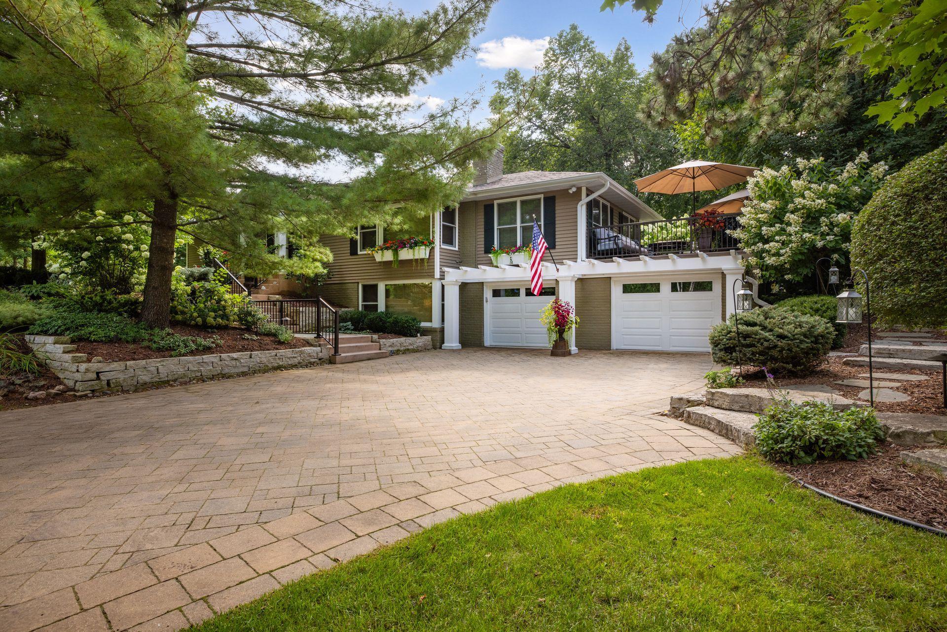 The stunning paver circular driveway makes a statement