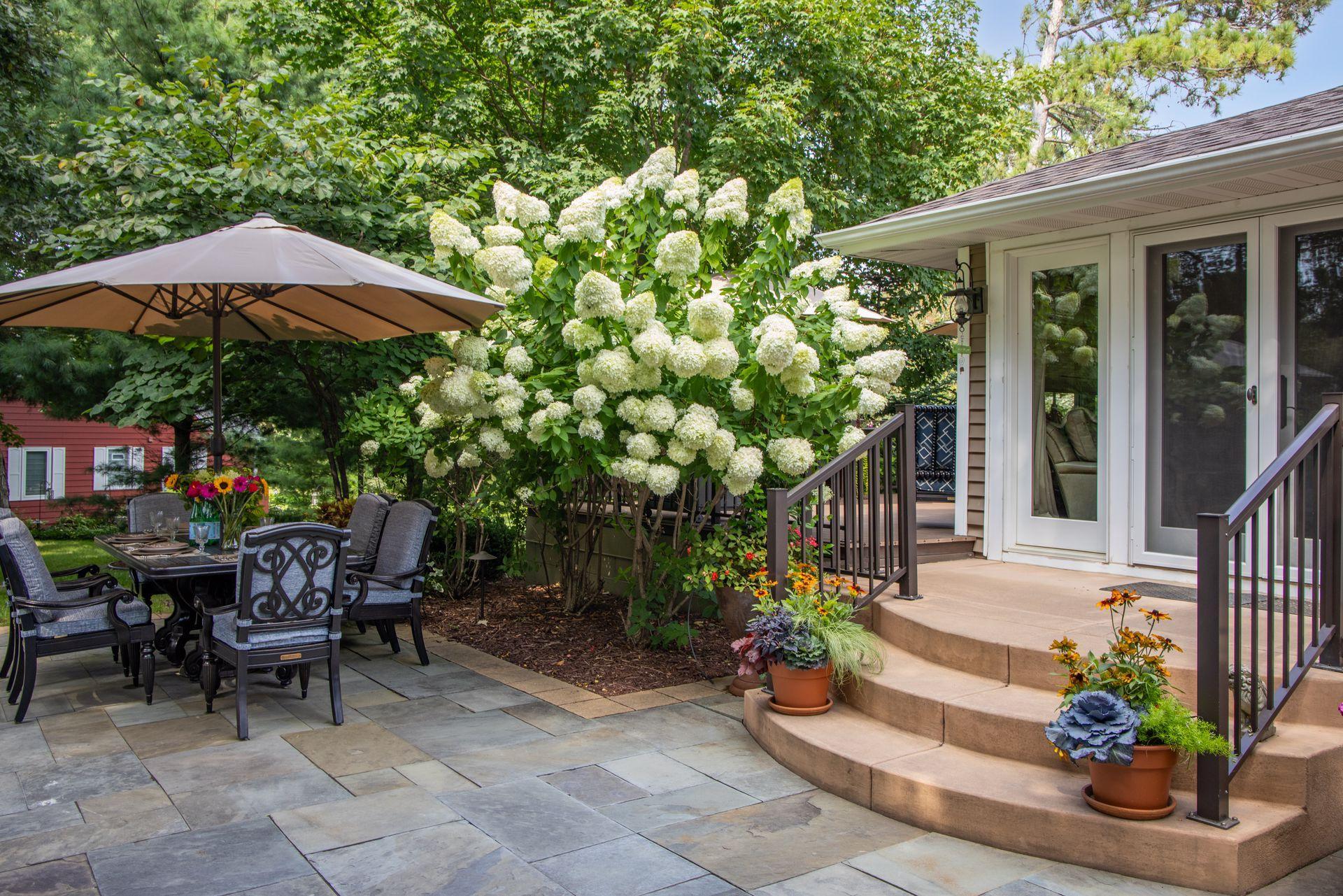 The yard is full of gorgeous landscaping which creates the perfect amount of privacy
