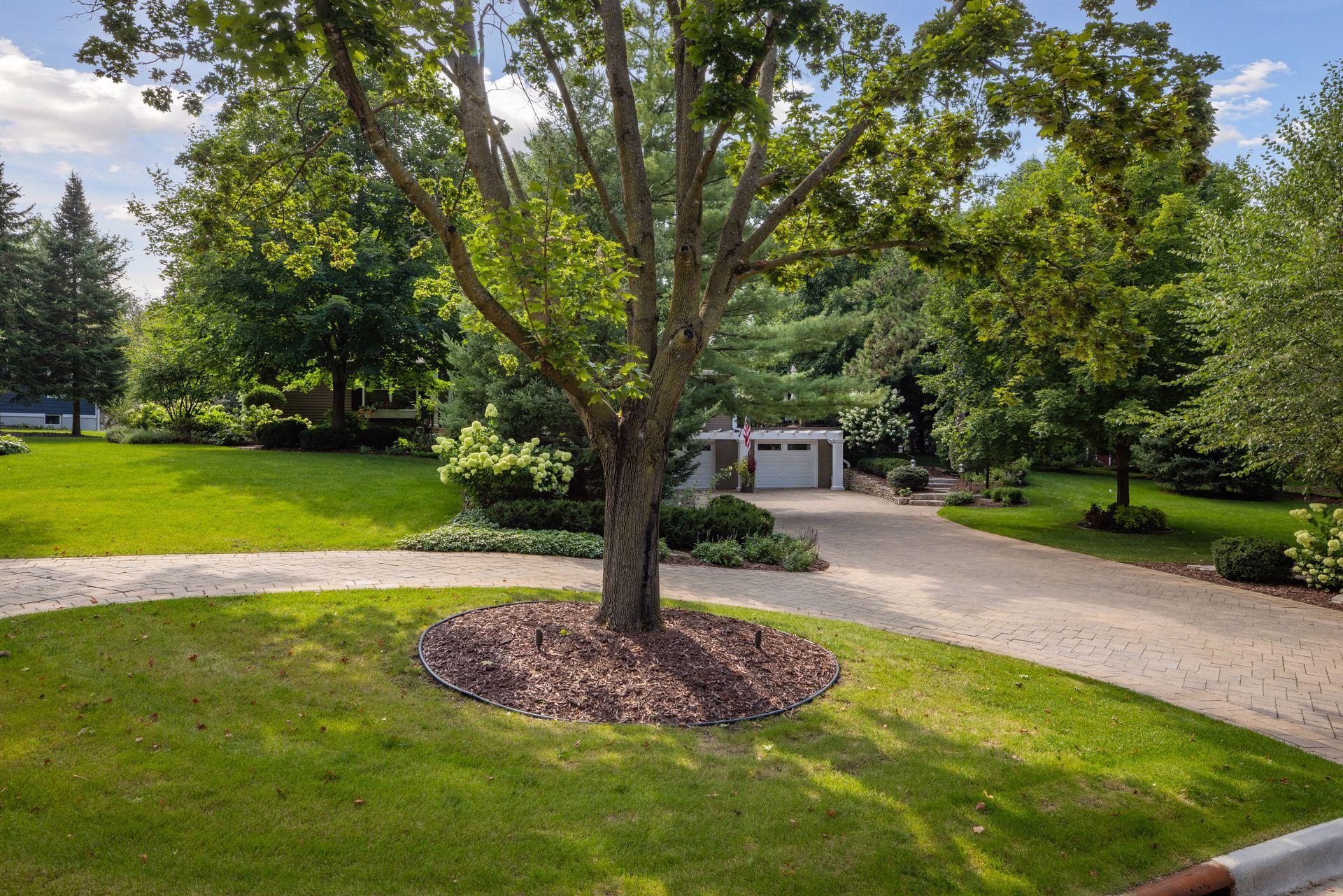 Wow, the impressive paver circular driveway is great for parking multiple cars