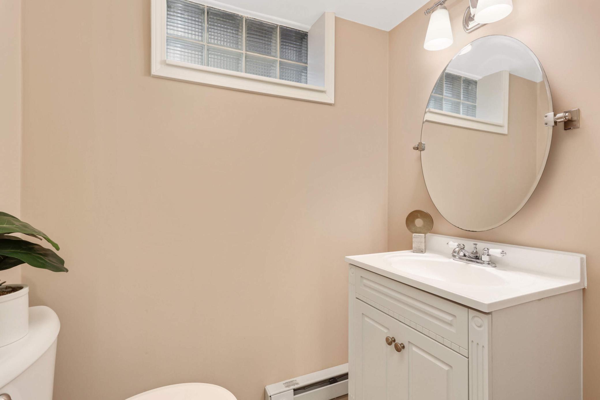 Just beyond the mudroom is an additional 1/2 bathroom.