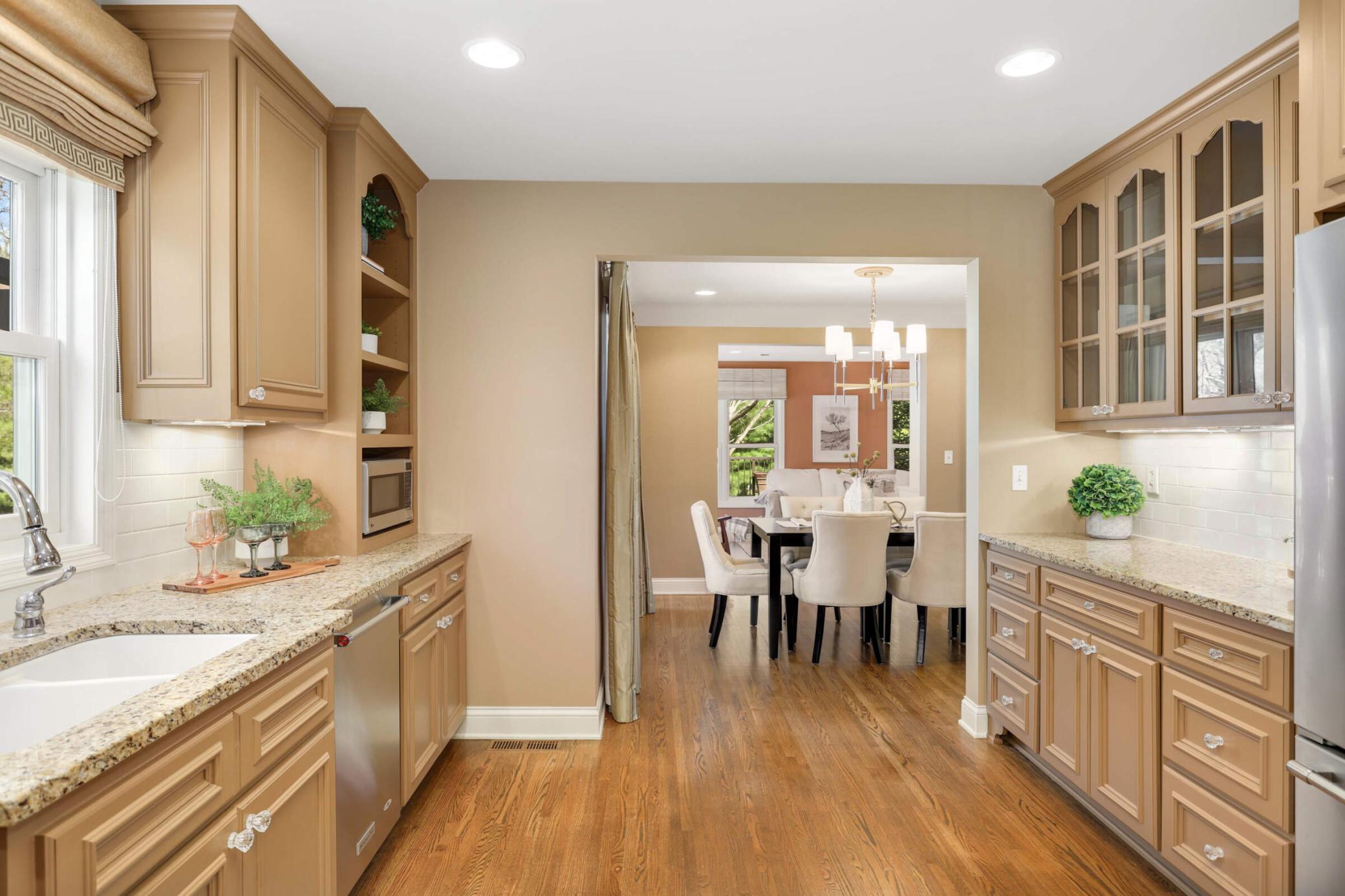 The designer kitchen features custom cabinetry