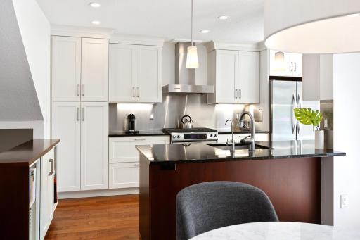 Ample counter space includes a breakfast bar!