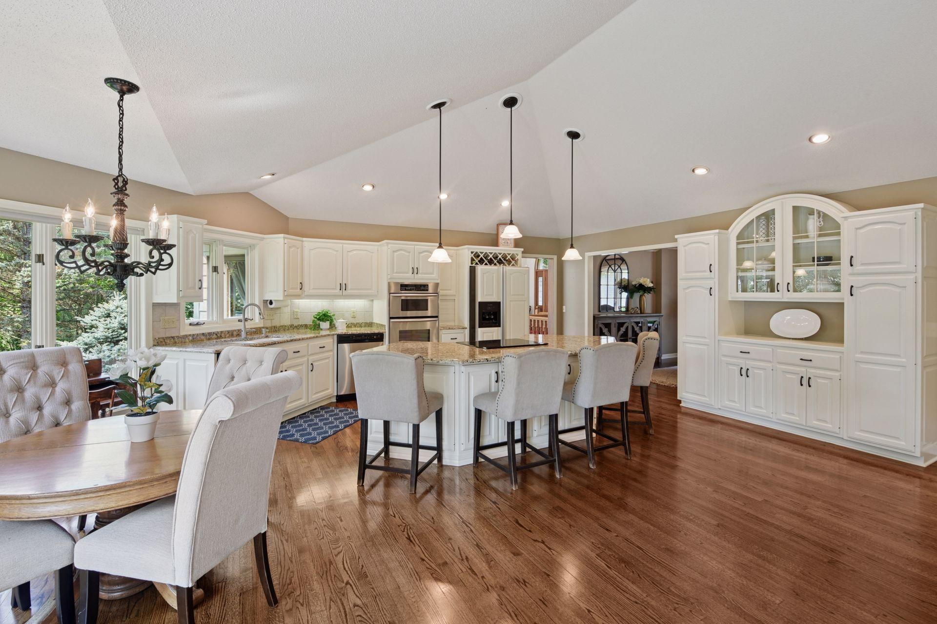 Spacious kitchen provides informal dining space and plenty of cabinets for storage